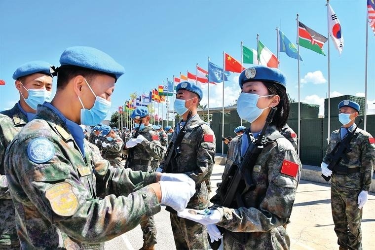 Photo taken on June 16, 2021 shows a medal award ceremony held at the Chinese peacekeeping troops’ camp in a village in southern Lebanon. All the 410 members of the 19th Chinese peacekeeping force to Lebanon were awarded the United Nations Peace Medal of Honor at the ceremony. (Photo by Liu Haowei)