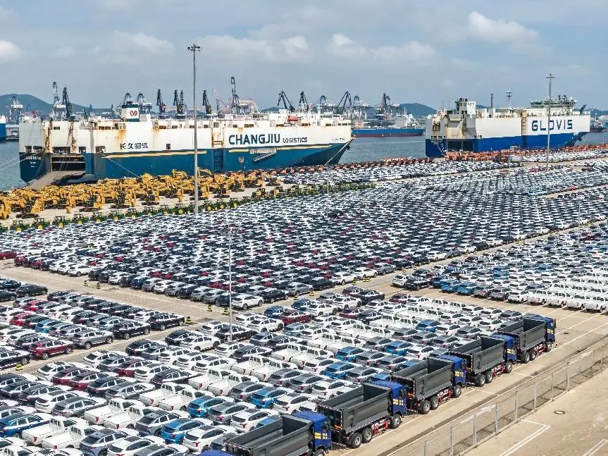 Vehicles are parked at a terminal in Yantai, east China's Shandong province, waiting to be shipped overseas, Sept. 3, 2022. (Photo by Zhang Chao/People's Daily Online)