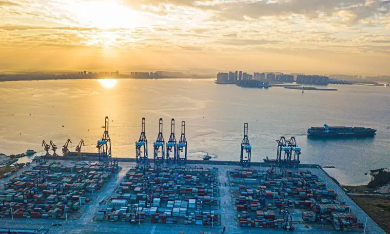 Aerial photo taken on Dec. 5, 2021 shows the sunrise scenery of the Yangpu international container port at Yangpu economic development zone in south China's Hainan Province.Photo:Xinhua