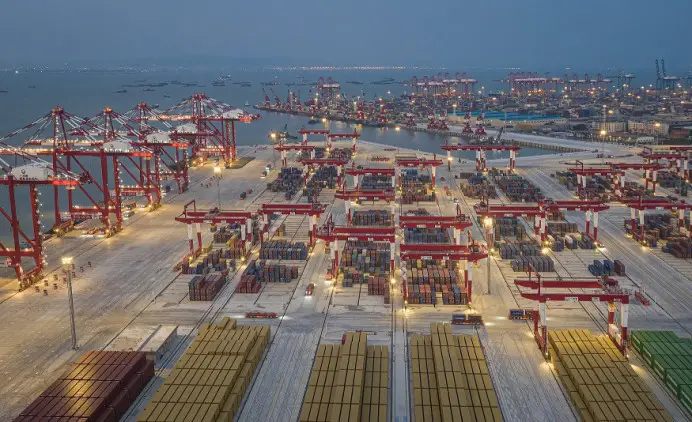 The fully automated terminal of Nansha port starts operation in Guangzhou, capital of south China's Guangdong province, in July 2022. In this picture, bridge cranes, rail-mounted gantry cranes and automated guide vehicles work in an orderly manner at the terminal under an intelligent control system . (Photo by Qiu Xinsheng/People's Daily Online)