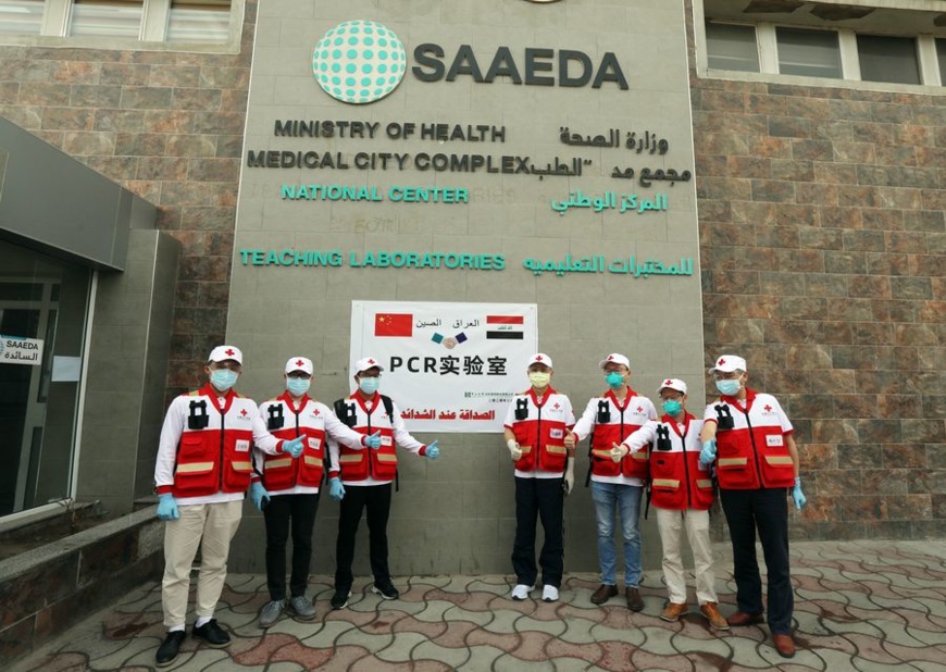 A Chinese team of health experts sent to provide assistance to contain the COVID-19 outbreak in Iraq pose for a group photo outside the new PCR laboratory in Baghdad, Iraq, March 25, 2020. (Xinhua/Khalil Dawood) A Chinese team of health experts sent to provide assistance to contain the COVID-19 outbreak in Iraq pose for a group photo outside the new PCR laboratory in Baghdad, Iraq, March 25, 2020. (Xinhua/Khalil Dawood)