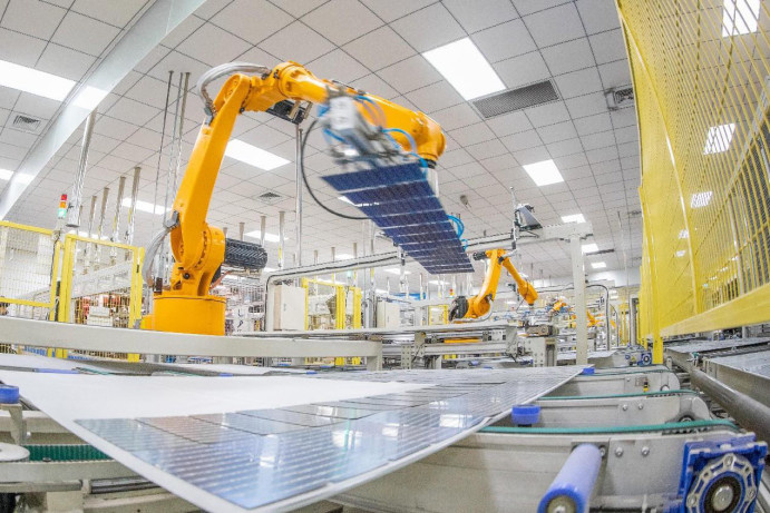 Photovoltaic (PV) panels are produced in a PV tech firm in Yiwu, east China's Zhejiang province, Jan. 22, 2023. (Photo by Wang Songneng/People's Daily Online)