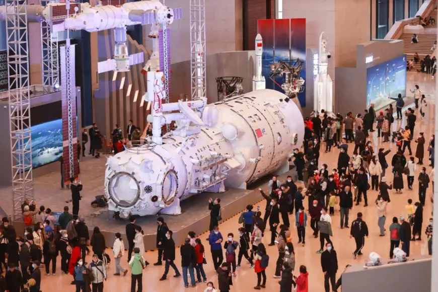 A model combination of the Tianhe core module and China's space station is exhibited at the National Museum of China, Feb. 28, 2023. (Photo by Chen Xiaogen/People's Daily Online)
