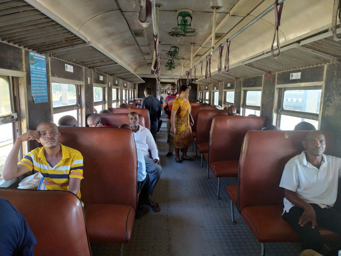 Passengers take a train of the Tanzania-Zambia Railway. (Photo by Huang Peizhao/People's Daily )