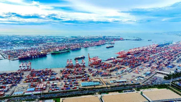 Photo taken on July 26, 2023 shows a busy scene of a container terminal of the Port of Qingdao in east China's Shandong province. Almost every day, there are vessels to and from BRICS countries loading and unloading cargos at the terminal. (Photo by Han Jiajun/People's Daily Online)