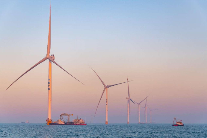 Photo shows an offshore wind farm in Yantai, east China's Shandong province. (Photo by Zhang Weikang/People's Daily Online) Photo shows an offshore wind farm in Yantai, east China's Shandong province. (Photo by Zhang Weikang/People's Daily Online)