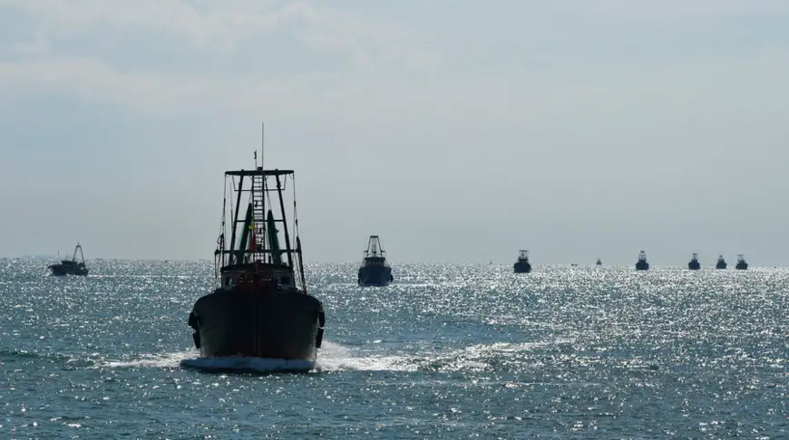 Fishing boats sail across the Qiongzhou Strait as the summer fishing moratorium ended in the South China Sea, Aug. 16, 2021. (Xinhua/Yang Guanyu)