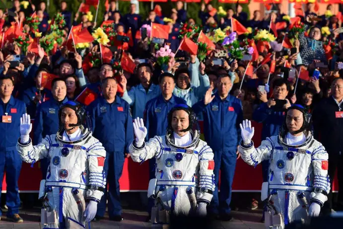 Chinese astronauts Tang Hongbo (R), Tang Shengjie (C) and Jiang Xinlin attend a see-off ceremony at the Jiuquan Satellite Launch Center in northwest China on Oct. 26, 2023. (Photo by Wang Xiaobo/People's Daily Online)