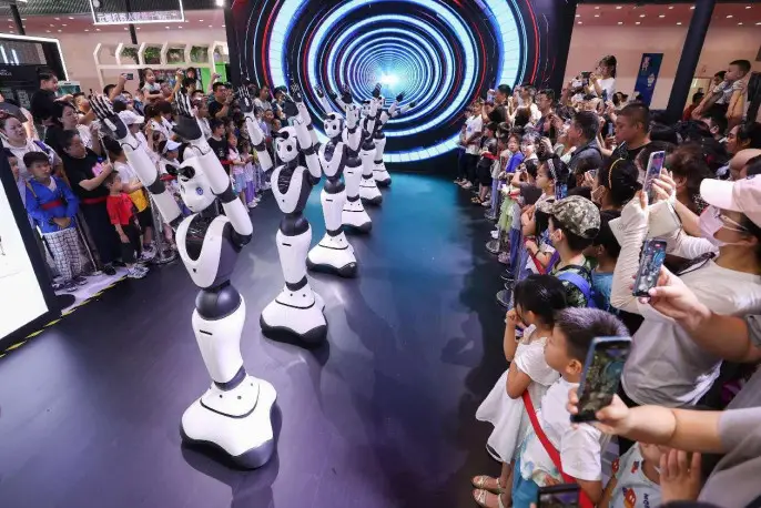 Robots dance at the 2023 World Robot Expo held in Beijing, Aug. 21, 2023. (Photo by Chen Xiaogen/People's Daily Online)