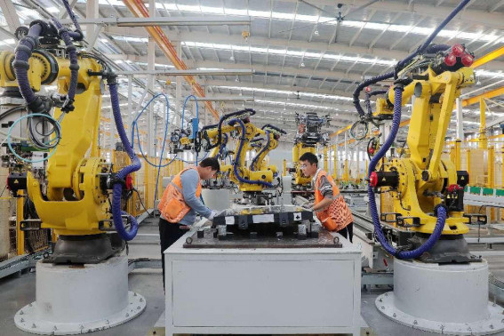 Workers manufacture high-end aluminum alloy parts for new energy vehicles in a workshop of a new material enterprise in Huaibei, east China's Anhui province. (Photo by Wan Shanzhao/People's Daily Online) Workers manufacture high-end aluminum alloy parts for new energy vehicles in a workshop of a new material enterprise in Huaibei, east China's Anhui province. (Photo by Wan Shanzhao/People's Daily Online)