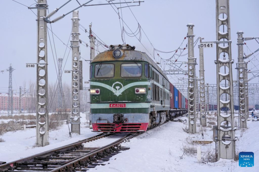 A China-Europe freight train prepares to pull out from the Horgos Port in Horgos, northwest China's Xinjiang Uygur Autonomous Region, Jan. 16, 2024. (Photo by Qiu Jing/Xinhua)