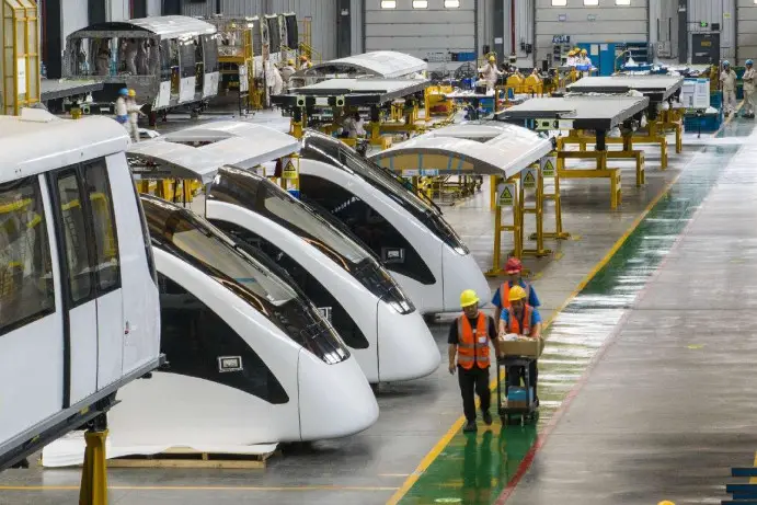 Autonomous driving urban rail transit trains to be exported are manufactured in a workshop of CRRC Puzhen Alstom Transportation Systems Limited in Wuhu, east China's Anhui province. (Photo by Xiao Benxiang/People's Daily Online)