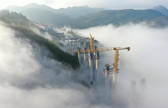 Photo taken on Jan. 31, 2024 shows the Nanming River grand bridge under construction in Guiyang, southwest China's Guizhou province. (Photo by Qiao Qiming/People's Daily Online) Photo taken on Jan. 31, 2024 shows the Nanming River grand bridge under construction in Guiyang, southwest China's Guizhou province. (Photo by Qiao Qiming/People's Daily Online)