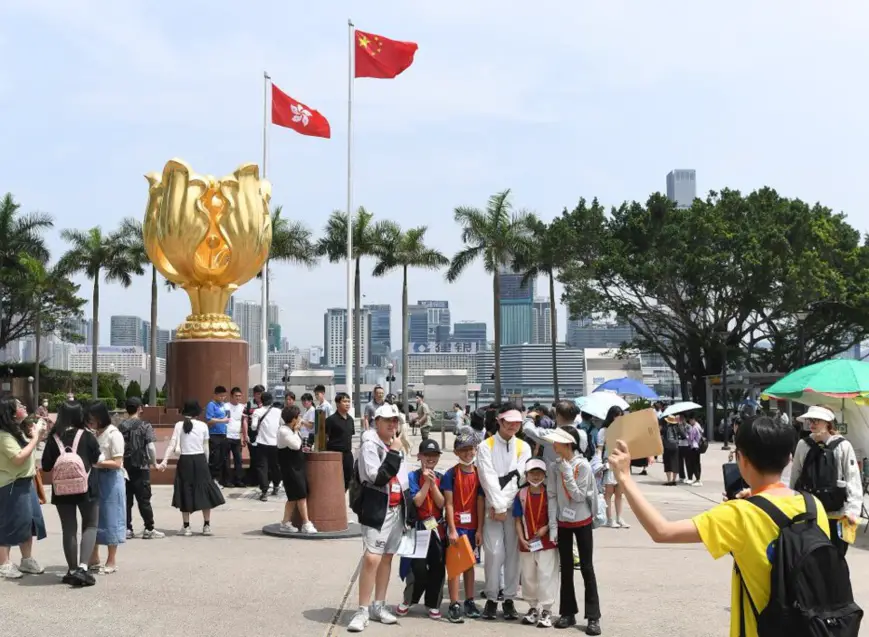 Tourists visit the Golden Bauhinia Square in south China's Hong Kong on April 30, 2023. (Xinhua/Chen Duo)