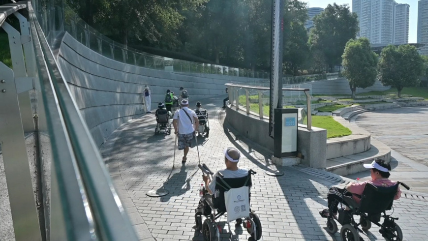 People with disabilities enter the Chongqing Planning Exhibition Gallery via an accessible ramp. (Photo by Mei Yao)