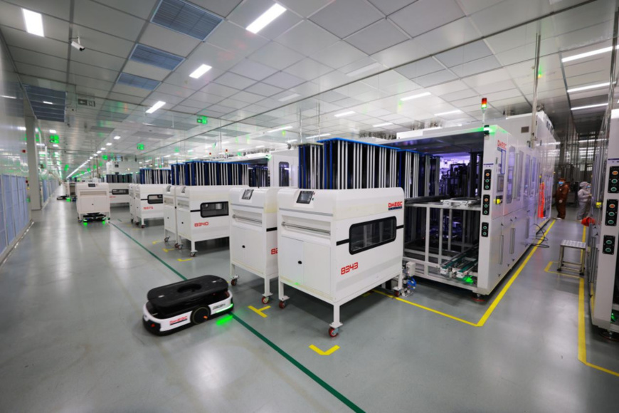 Automated guided vehicles transport battery packs in a workshop of a new energy company in Yibin, southwest China's Sichuan province. (Photo by Lan Feng/People's Daily Online)