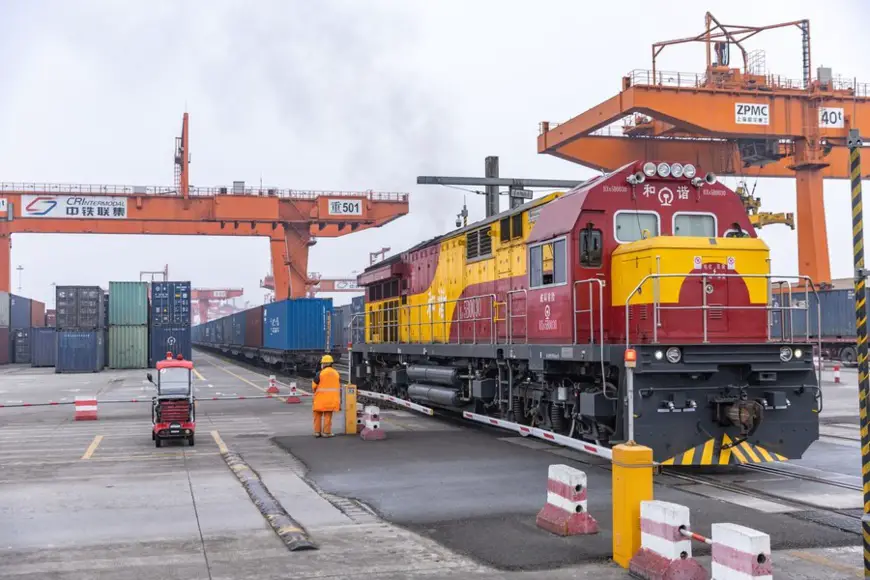 A China-Europe freight train loaded with machinery, automobiles and auto parts waits for departure at a railway station in Chongqing, southwest China, March 7, 2024. (Xinhua/Huang Wei)