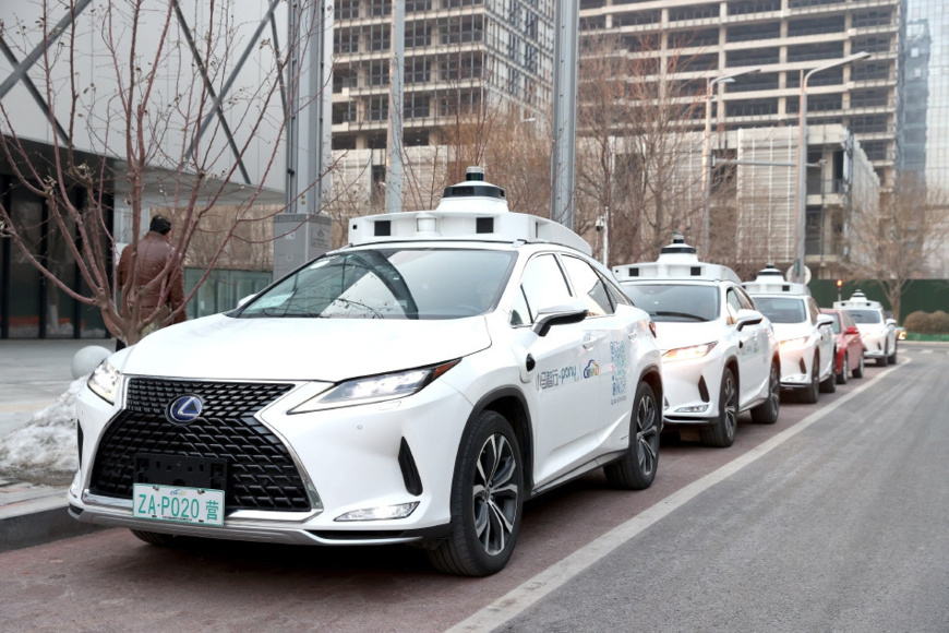 Photo shows autonomous vehicles on a street of Beijing Economic-Technological Development Area. (Photo by Wu Jiang) Photo shows autonomous vehicles on a street of Beijing Economic-Technological Development Area. (Photo by Wu Jiang)