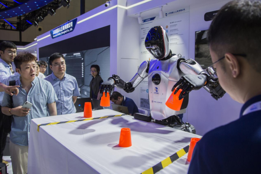 A robot shows its ability at the exhibition booth of Humanoid Robot (Shanghai) Co., Ltd. at the 2024 World AI Conference, east China's Shanghai, July 5, 2024. (Photo by Xu Kunde/People's Daily Online) A robot shows its ability at the exhibition booth of Humanoid Robot (Shanghai) Co., Ltd. at the 2024 World AI Conference, east China's Shanghai, July 5, 2024. (Photo by Xu Kunde/People's Daily Online)