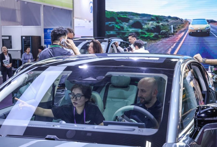 A purchaser learns about an electric vehicle during the 135th session of the China Import and Export Fair in Guangzhou, south China's Guangdong Province, April 15, 2024. (Xinhua/Liu Dawei) A purchaser learns about an electric vehicle during the 135th session of the China Import and Export Fair in Guangzhou, south China's Guangdong Province, April 15, 2024. (Xinhua/Liu Dawei)