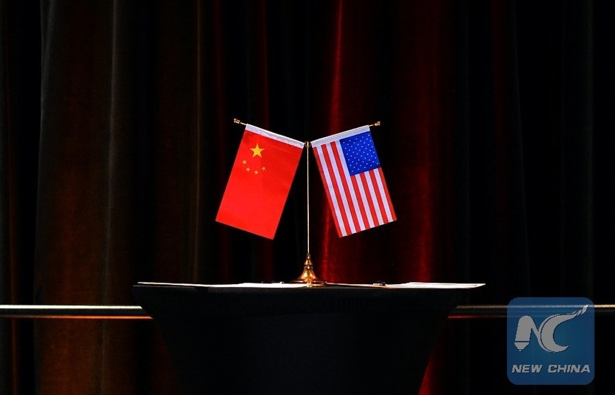 Photo shows Chinese and U.S. national flags. (Xinhua) Photo shows Chinese and U.S. national flags. (Xinhua)