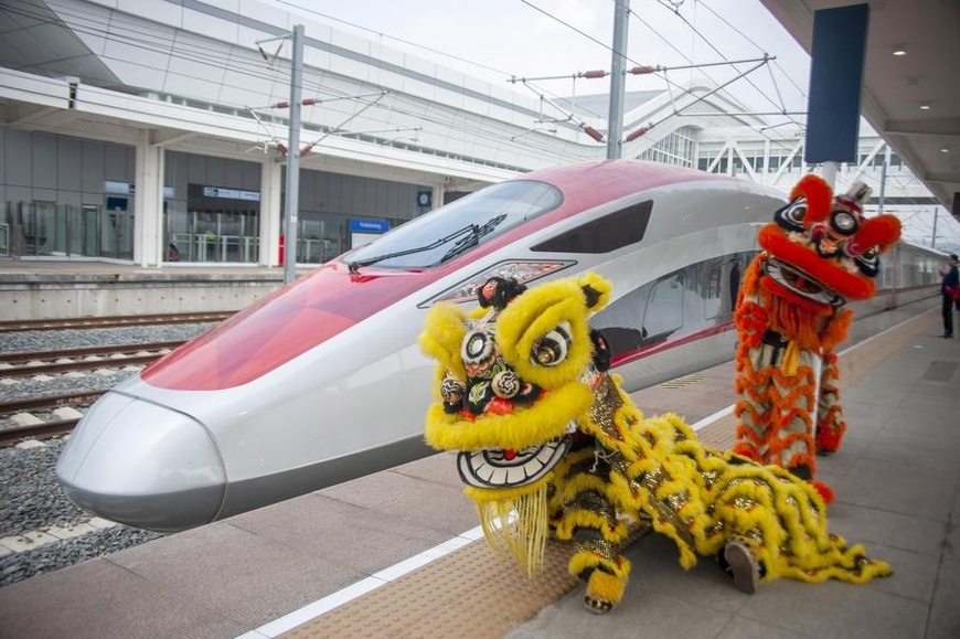 Lion dance performers pose for photos with a high-speed electrical multiple unit (EMU) train on the platform at the Jakarta-Bandung High-Speed Railway's Padalarang Station in Padalarang, Indonesia, Feb. 10, 2024. (Photo by Septianjar Muharam/Xinhua) Lion dance performers pose for photos with a high-speed electrical multiple unit (EMU) train on the platform at the Jakarta-Bandung High-Speed Railway's Padalarang Station in Padalarang, Indonesia, Feb. 10, 2024. (Photo by Septianjar Muharam/Xinhua)