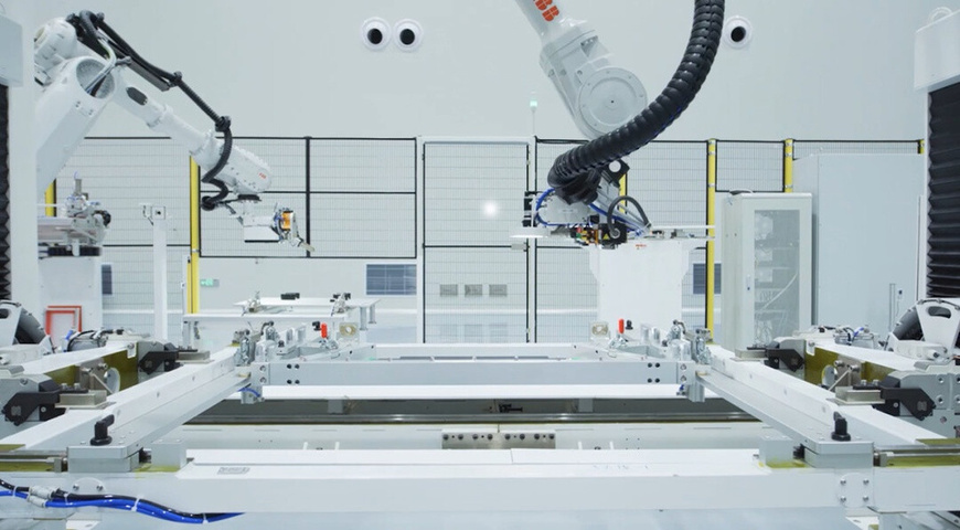 Robotic arms work in a workshop of the satellite manufacturing factory of Geely.