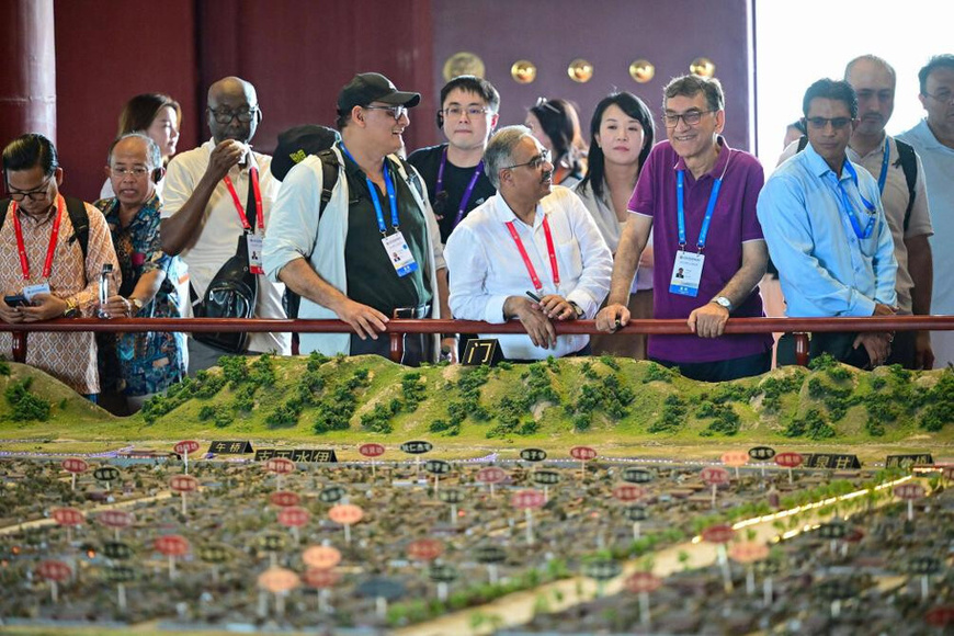 Guests attending the Shanghai Cooperation Organization (SCO) Media and Think Tank Summit visit the Dingding Gate Site Museum in Luoyang, central China's Henan province, on July 26, 2025. (Photo/Li Weichao) Guests attending the Shanghai Cooperation Organization (SCO) Media and Think Tank Summit visit the Dingding Gate Site Museum in Luoyang, central China's Henan province, on July 26, 2025. (Photo/Li Weichao)