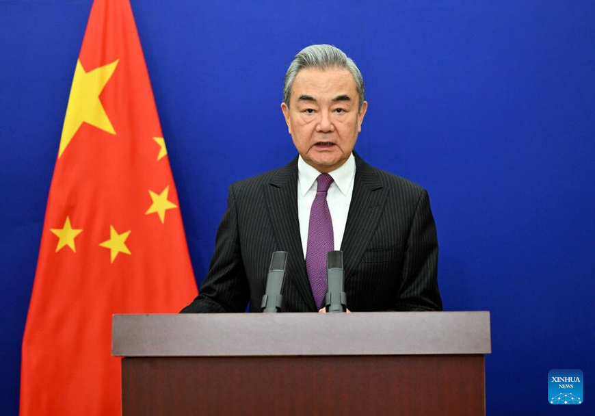 Chinese Foreign Minister Wang Yi, also a member of the Political Bureau of the Communist Party of China Central Committee, gives a speech via video link at the high-level segment of the 61st session of the United Nations Human Rights Council, in Beijing, capital of China, on Feb. 23, 2026. (Xinhua/Yin Bogu)