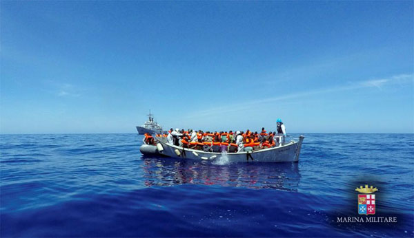 A rescue operation by the Italian navy ship Grecale (unseen) off the coast of Sicily, Italy. Photo: Marina Militare, May 6, 2016