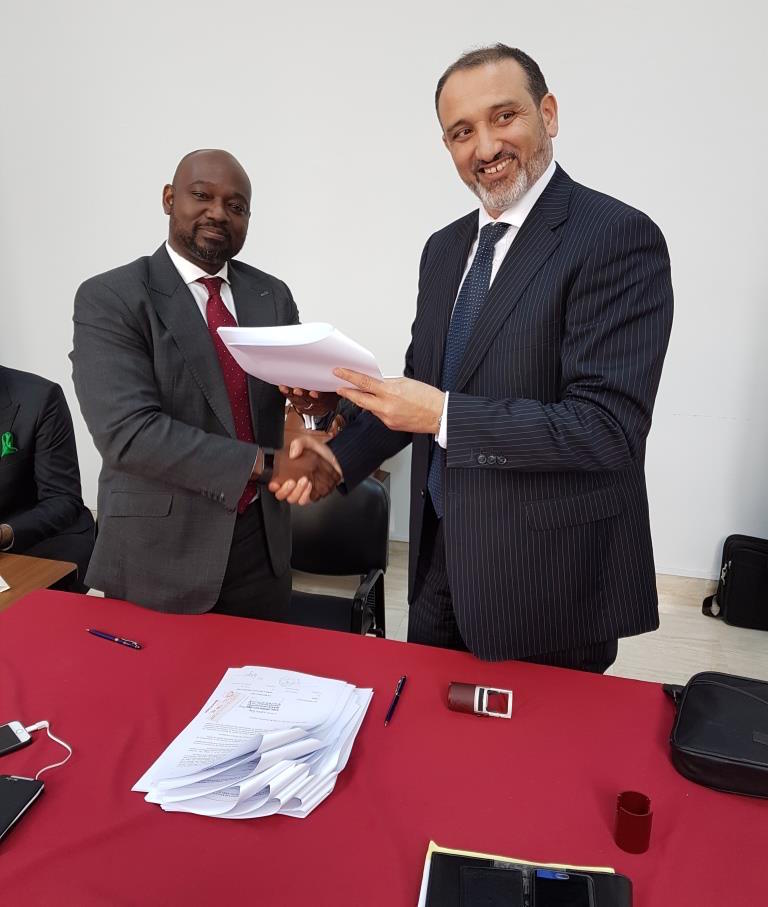 Osam Iyahen, Vice President of Investments and Natural Resources at AFC and Mohamed Toumi, CEO of Topic during the signing of the agreement.