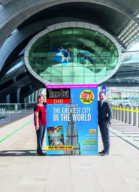 Sue Holt, Executive Director ITP Media Group and Eugene Barry, EVP Commercial at Dubai Airports with a larger than life Time Out DXB front cover (Photo: AETOSWIRE).