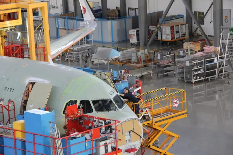 A worker assembles an Airbus A320 family aircraft on a final assembly line in Tianjin. (Photo by Li Yingqi from People’s Daily)
