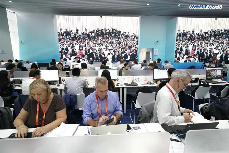 Journalists work at the media center of the first China International Import Expo (CIIE) in Shanghai, east China, Nov. 5, 2018. The first CIIE opened here on Monday and has drawn much attention from domestic and international media. (Xinhua/Shen Bohan)