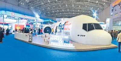 Photo taken is the exhibition booth of US logistic giant FedEx at the ongoing first China International Import Expo (CIIE). The company recently launched a package of logistics solutions in China, including one-stop customs clearance services for cross-border retailers. (Photo by Huang Chao from People’s Daily)