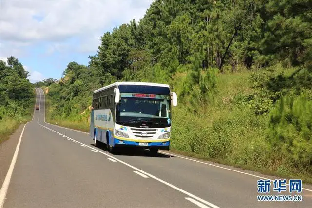 A bus is running on Fiji's Nabouwalu highway undertaken by a Chinese company.