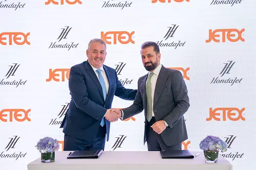 Adel Mardini of Jetex signs with Simon Roads of Honda Aircraft Company (Photo: AETOSWire)