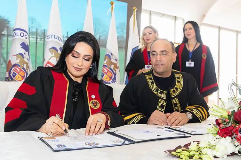Dr. Nashwa Al Ruwaini Signing at the Award Ceremony of her Honorary PhD from the Oxford College for Research and PHD Studies (Photo: AETOSWire)