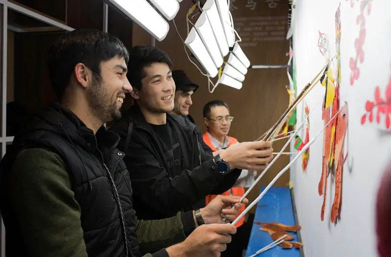 International students from the International Exchange College of Inner Mongolia Normal University play shadow puppets at the Inner Mongolia Exhibition Museum in Hohhot, capital of north China’s Inner Mongolia Autonomous Region, April 25, 2019. A total of 32 international students from Mongolia, Russia, Tajikistan, Laos, Cambodia, Pakistan and other countries participated in this cultural activity.