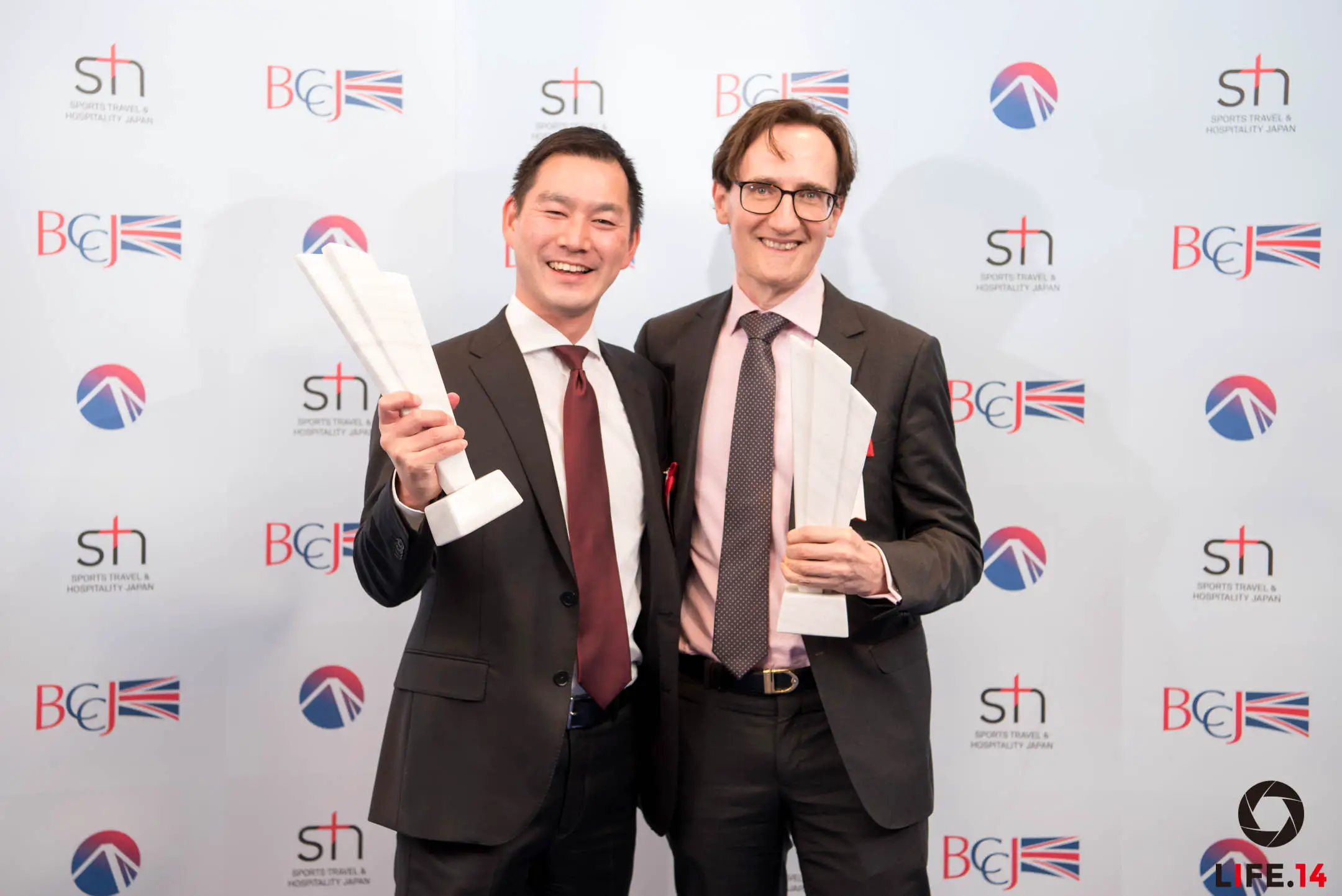 Collecting the award in Tokyo, Liam Hickey, Chief Financial Officer at Azuri Technologies (right) and Suguru Tsuzaki from the Power Business Division, Marubeni Corporation.