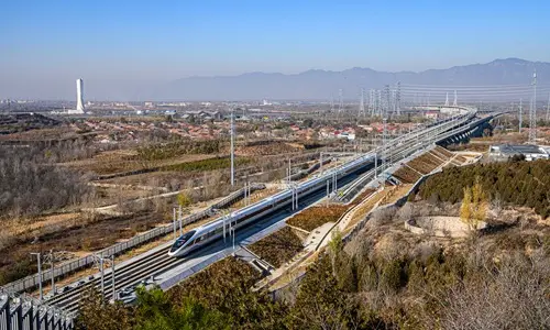 A bullet train tests operations along the high-speed railway line connecting Beijing and Zhangjiakou in North China’s Hebei Province in November, 2019. (Photo by CFP)