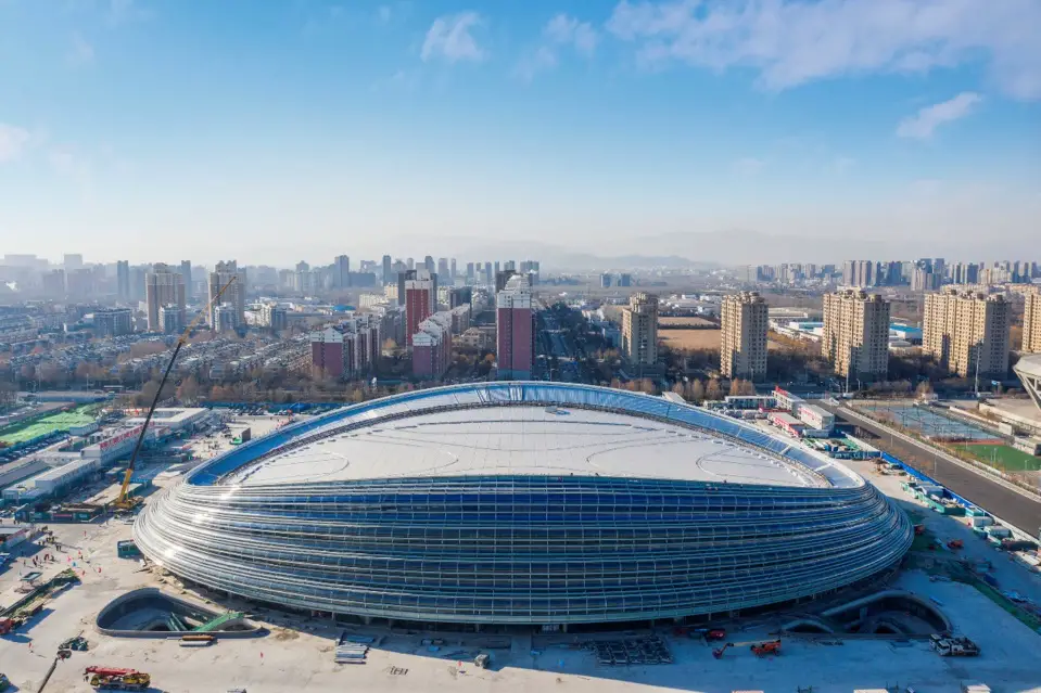 The landmark venue for the 2022 Winter Olympics - the National Speed Skating Oval, also known as the "Ice Ribbon", is capped, Dec. 31, 2019. Photo by He Yong/People’s Daily