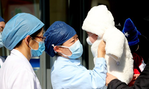 A 7-month-old infant is discharged from a hospital in Shanghai after recovery from COVID-19. (Photo by Yang Hui, Global Times)
