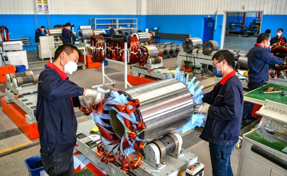 On the morning of March 25, 2020, workers in the large motor workshop of the Hebei large motor workshop at the equipment manufacturing base in Luancheng District, Shijiazhuang City, Hebei Province, are shaping the winding end of the low-voltage high-power motor. Photo by Li Mingfa from People’s Daily Online