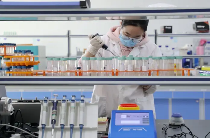 A researcher works in a lab in East China’s Zhejiang Province on February 20. Photo by Xie Shangguo/People’s Daily Online