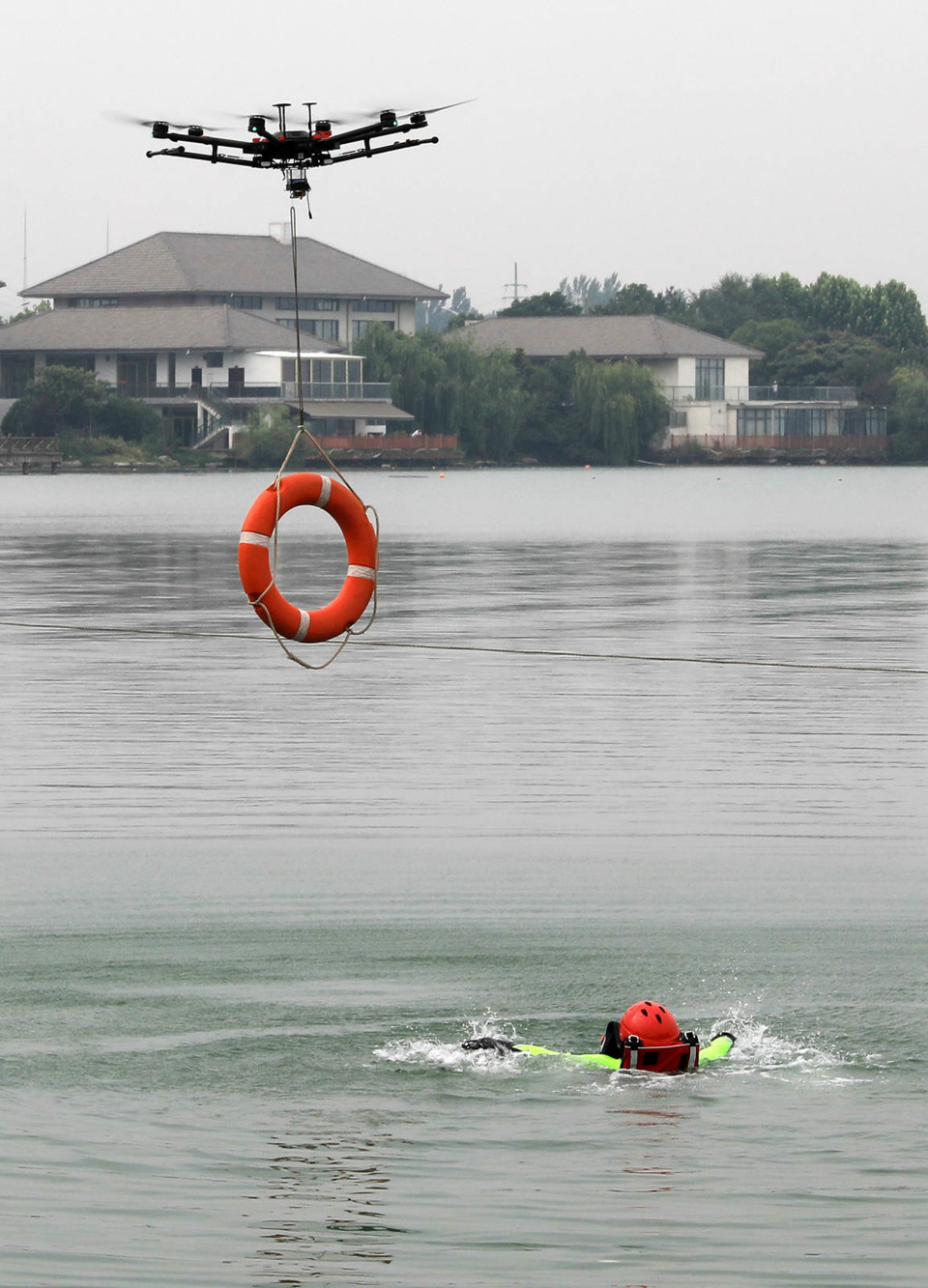 A drone rescues a man in the South Lake of Huaibei, Anhui Province in East China, July 4, 2019. (Photo by Yue Jianwen/People’s Daily Online)