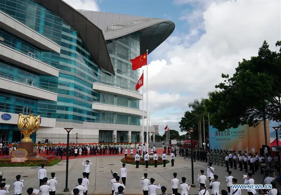A flag-raising ceremony is held by the government of the Hong Kong Special Administrative Region to celebrate the 23rd anniversary of Hong Kong's return to the motherland at the Golden Bauhinia Square in Hong Kong, south China, July 1, 2020. (Xinhua/Li Gang)