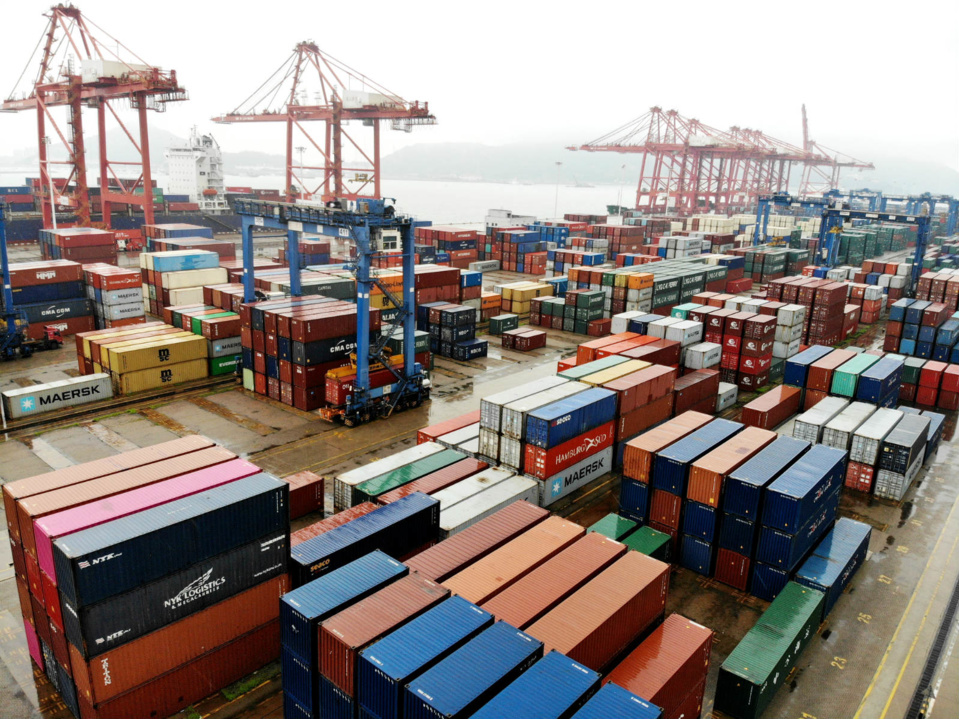 Photo taken on July 19 shows a batch of containers stacking at a container terminal in Lianyungang, East China’s Jiangsu province, waiting to be transported overseas. Photo by Wang Chun/ People’s Daily Online