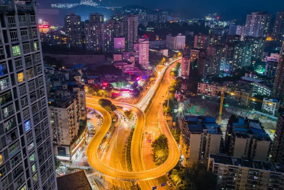 Photo taken in September 2020 shows the night view of a landmark flyover in Shapingba district, southwest China's Chongqing municipality, which mirrors the resilience of the Chinese economy in the post-COVID-19 era. (Photo by Sun Kaifang/People's Daily Online)