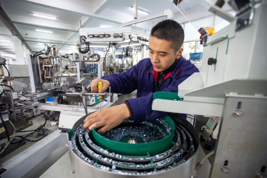 A worker manufactures electrical products ordered by Chinese and Southeast Asian customers at a foreign invested production base in Hai'an economic and technology development zone, east China's Jiangsu province, Nov. 4, 2020. (Photo by Zhai Huiyong/People's Daily Online)